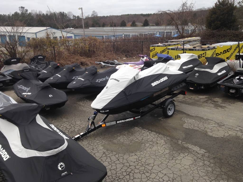 group of jet skis with covers