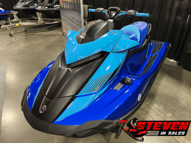 Blue Yamaha waverunner lined up at the dealership with two more on a double behind it. 