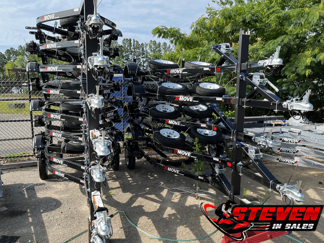 A large stack of black Sea-Doo MOVE I trailers